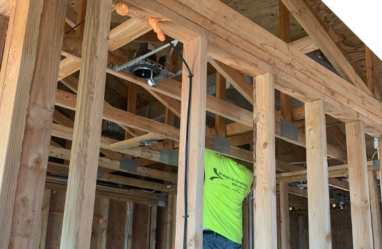 Show thumbnail preview A man is installing wood framing in a house while also providing Maui HVAC services. A man is installing wood framing in a house while also providing Maui HVAC services.